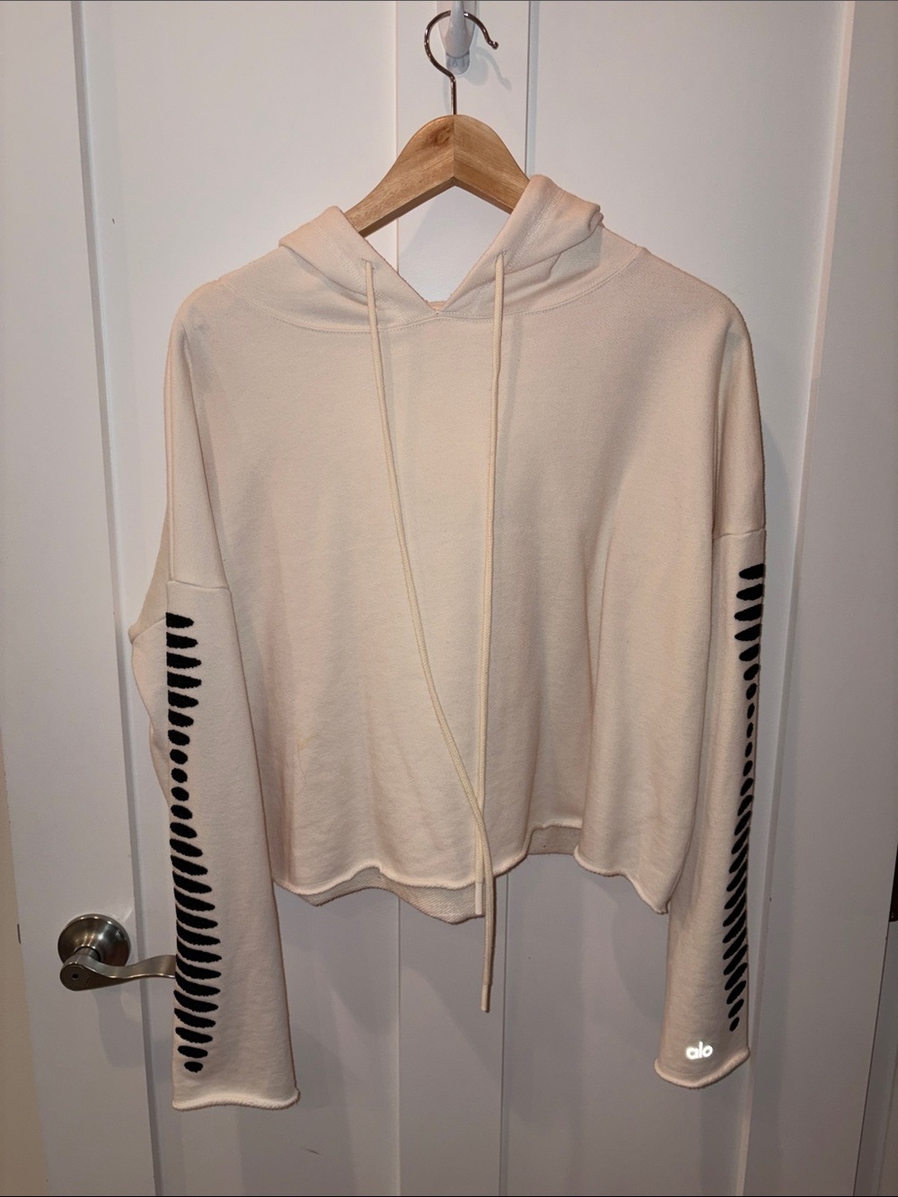 ALO Yoga Cream Cropped Hoodie with Beaded Black Sleeve Accent